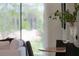 Modern dining area with marble table and black chairs, offering a bright and airy space at 700 Preston Cove Dr, St Cloud, FL 34771