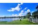 Scenic view of a lake with lush green grass and palm trees at 934 Lake Destiny Rd # D, Altamonte Springs, FL 32714