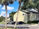 Exterior of condo building with parking and tropical landscaping at 934 Lake Destiny Rd # D, Altamonte Springs, FL 32714