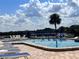 Community pool with lounge chairs and lake view at 934 Lake Destiny Rd # D, Altamonte Springs, FL 32714