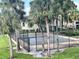 Community tennis court surrounded by palm trees at 934 Lake Destiny Rd # D, Altamonte Springs, FL 32714