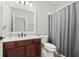 Bathroom with a toilet, shower, and vanity with marble top at 11731 Bella Milano Ct, Windermere, FL 34786