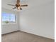 Bright bedroom with large window and ceiling fan at 14646 Brightwell Ct, Orlando, FL 32824