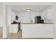 Modern kitchen featuring white cabinets and granite countertops at 14646 Brightwell Ct, Orlando, FL 32824