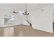 Bright living room with high ceilings, chandelier, and staircase at 14646 Brightwell Ct, Orlando, FL 32824