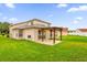 House back view with pergola and patio at 14646 Brightwell Ct, Orlando, FL 32824