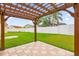 Wooden pergola with view of backyard and fence at 14646 Brightwell Ct, Orlando, FL 32824