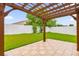 Wooden pergola covering a patio area in backyard at 14646 Brightwell Ct, Orlando, FL 32824