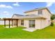 House exterior showing back of house, lawn, and pergola at 14646 Brightwell Ct, Orlando, FL 32824