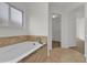 Bathroom with garden tub and walk-in closet at 14646 Brightwell Ct, Orlando, FL 32824