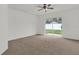 Spacious bedroom with carpeting and sliding glass doors to patio at 14646 Brightwell Ct, Orlando, FL 32824