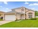 Two-story house with landscaping at 14646 Brightwell Ct, Orlando, FL 32824