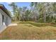 Private backyard with a large grassy area and mature trees at 15123 Sw 61St Court Rd, Ocala, FL 34473