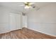 Spacious bedroom with wood-look flooring and ceiling fan at 23 Spring Ridge Dr, Debary, FL 32713