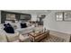 Open concept living room and kitchen with neutral color palette at 2626 Sage Valley Way, Winter Haven, FL 33884