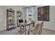Bright office with desk, chairs, and bookshelves at 2626 Sage Valley Way, Winter Haven, FL 33884