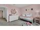 Bedroom with a light green bed frame and white dresser at 2626 Sage Valley Way, Winter Haven, FL 33884