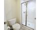 Clean bathroom with a walk-in shower and a toilet at 3053 Gatsby St, Kissimmee, FL 34746