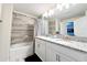 Bathroom with a bathtub, double vanity, and granite countertop at 3053 Gatsby St, Kissimmee, FL 34746