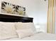 Main bedroom with plush bedding and a tranquil atmosphere at 3053 Gatsby St, Kissimmee, FL 34746