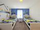 Minion-themed bedroom with two twin beds and nightstand at 3053 Gatsby St, Kissimmee, FL 34746