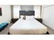 King-size bed, plush bedding, and a teal bench in a spacious bedroom at 3053 Gatsby St, Kissimmee, FL 34746