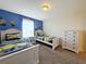 Two twin beds in a Minion-themed bedroom with white dresser at 3053 Gatsby St, Kissimmee, FL 34746