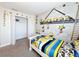 Minion-themed bedroom with a twin bed and closet at 3053 Gatsby St, Kissimmee, FL 34746
