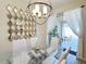 Bright dining room with glass table, white chairs, and pool view at 3053 Gatsby St, Kissimmee, FL 34746
