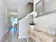 Bright and airy entryway with a console table and mirrors at 3053 Gatsby St, Kissimmee, FL 34746