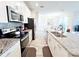 Modern kitchen with stainless steel appliances and granite countertops at 3053 Gatsby St, Kissimmee, FL 34746