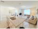 Modern kitchen with an island, stainless steel appliances, and granite countertops at 3053 Gatsby St, Kissimmee, FL 34746