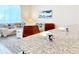 Kitchen with granite countertops, and a view into the living room at 3053 Gatsby St, Kissimmee, FL 34746