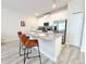 Modern kitchen with stainless steel appliances and granite countertops at 3053 Gatsby St, Kissimmee, FL 34746
