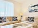 Living room with sofas, coffee table, and coastal-themed decor at 3053 Gatsby St, Kissimmee, FL 34746