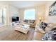 Spacious living room with comfy sofas and a large TV at 3053 Gatsby St, Kissimmee, FL 34746