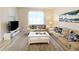Living room featuring a taupe sofa, coffee table and artwork at 3053 Gatsby St, Kissimmee, FL 34746