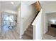 Modern staircase leading to the upper level of the home at 3053 Gatsby St, Kissimmee, FL 34746