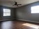 Spacious bedroom with dark wood floors and ceiling fan at 5003 Shelley Ct, Lakeland, FL 33805