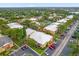 Aerial view of apartment community showcasing building exteriors and parking at 604 Kenwick Cir # 202, Casselberry, FL 32707