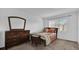 Well-lit bedroom with a double bed and dresser at 604 Kenwick Cir # 202, Casselberry, FL 32707