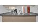 Kitchen features a breakfast bar and modern appliances at 604 Kenwick Cir # 202, Casselberry, FL 32707
