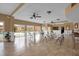 Community room with tables and chairs, pool view at 604 Kenwick Cir # 202, Casselberry, FL 32707