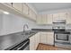 Modern kitchen with stainless steel appliances and ample cabinetry at 604 Kenwick Cir # 202, Casselberry, FL 32707