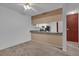 Kitchen with breakfast bar and appliances at 604 Kenwick Cir # 202, Casselberry, FL 32707