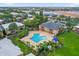 Community pool with surrounding lounge chairs and landscaping at 604 Kenwick Cir # 202, Casselberry, FL 32707