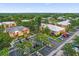 Aerial view of apartment community showing building exteriors and parking at 604 Kenwick Cir # 202, Casselberry, FL 32707