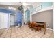 Bright dining area with hardwood floors and view to Gathering room at 709 Lake Emerald Ave, Orange City, FL 32763