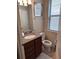 Powder room with single vanity and granite countertop at 9066 Rhodes St, Kissimmee, FL 34747