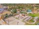 Aerial view of a resort-style pool and a sand volleyball court at 121 Palermo St, Davenport, FL 33897